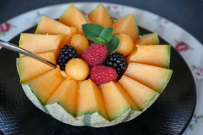 Fresh melon topped with berries